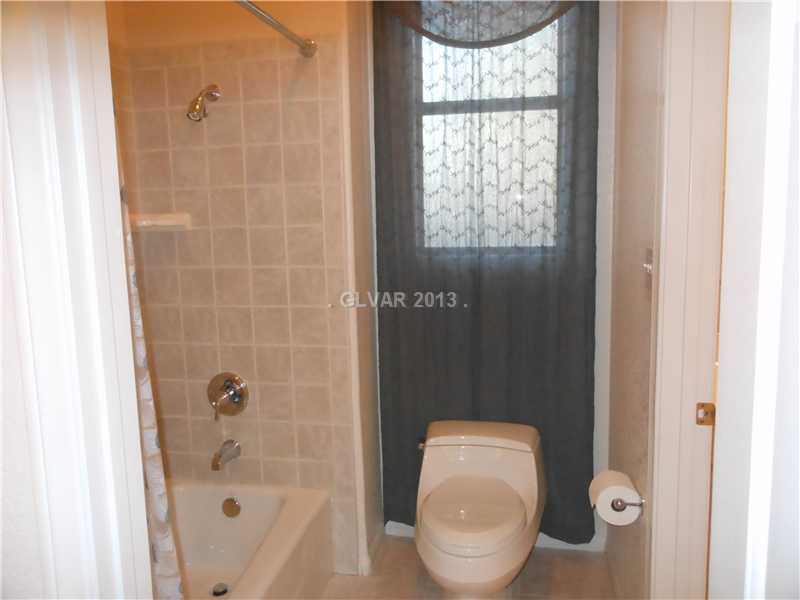 4716 Monument Valley Road Las Vegas, NV 89129 - Photo 21 of 31 Property Photo. Beautiful tiled surrounds at Jack and Jill bath.