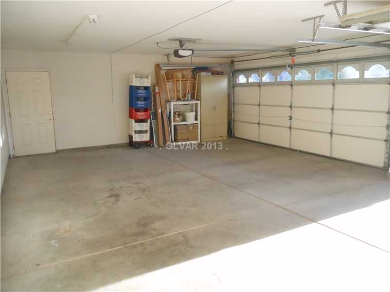 4716 Monument Valley Road Las Vegas, NV 89129 - Photo 24 of 31 Property Photo. 3 car garage with openers on each door. Side door for rear access.