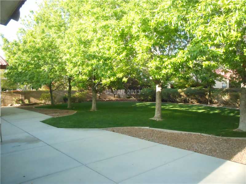 4716 Monument Valley Road Las Vegas, NV 89129 - Photo 27 of 31 Property Photo. Large exterior patio invites you to your park like setting in back yard.