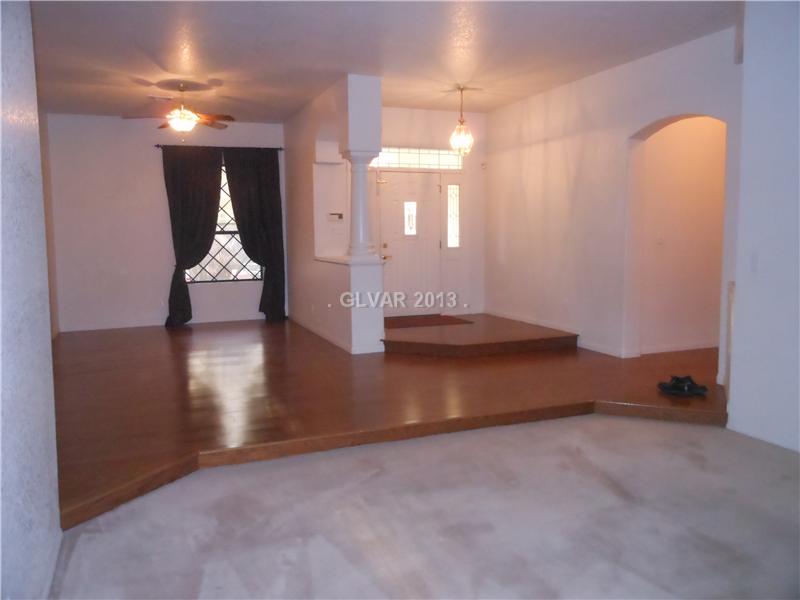 4716 Monument Valley Road Las Vegas, NV 89129 - Photo 3 of 31 Property Photo. Formal living room looking towards entry and formal dining to right.