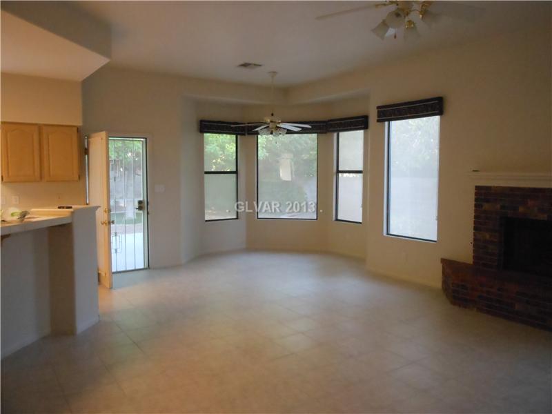 4716 Monument Valley Road Las Vegas, NV 89129 - Photo 7 of 31 Property Photo. Enjoy breakfast at the kitchen raised island or separate nook that looks out to the beautifully landscaped back yard.