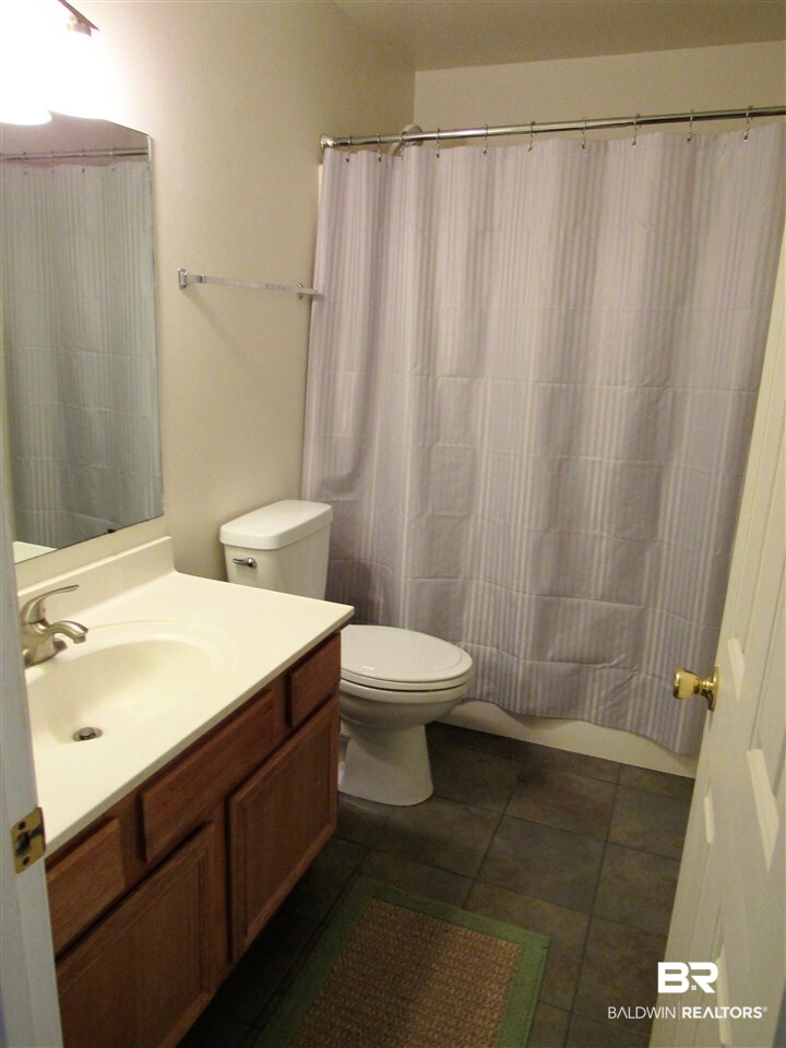 510 Ariel Avenue Foley, AL 36535 - Photo 9 of 18 Second bath is updated. Tiled floors and modern