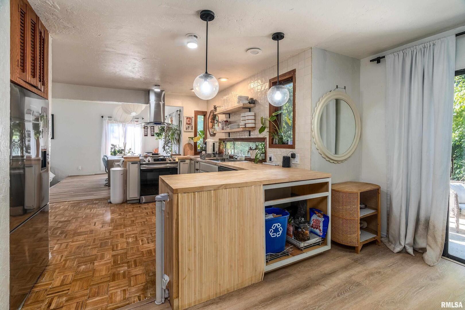 183 Heritage Road Carbondale, IL 62903 - Photo 15 of 50 a kitchen with stainless steel appliances granite countertop a stove a sink and a refrigerator