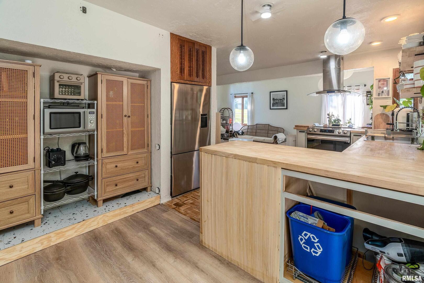 183 Heritage Road Carbondale, IL 62903 - Photo 16 of 50 a kitchen that has a lot of cabinets and wooden floor