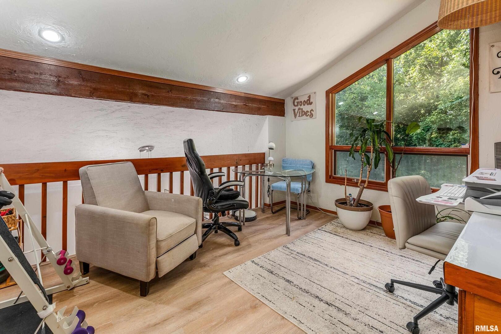 183 Heritage Road Carbondale, IL 62903 - Photo 22 of 50 a living room with furniture a rug and a floor to ceiling window