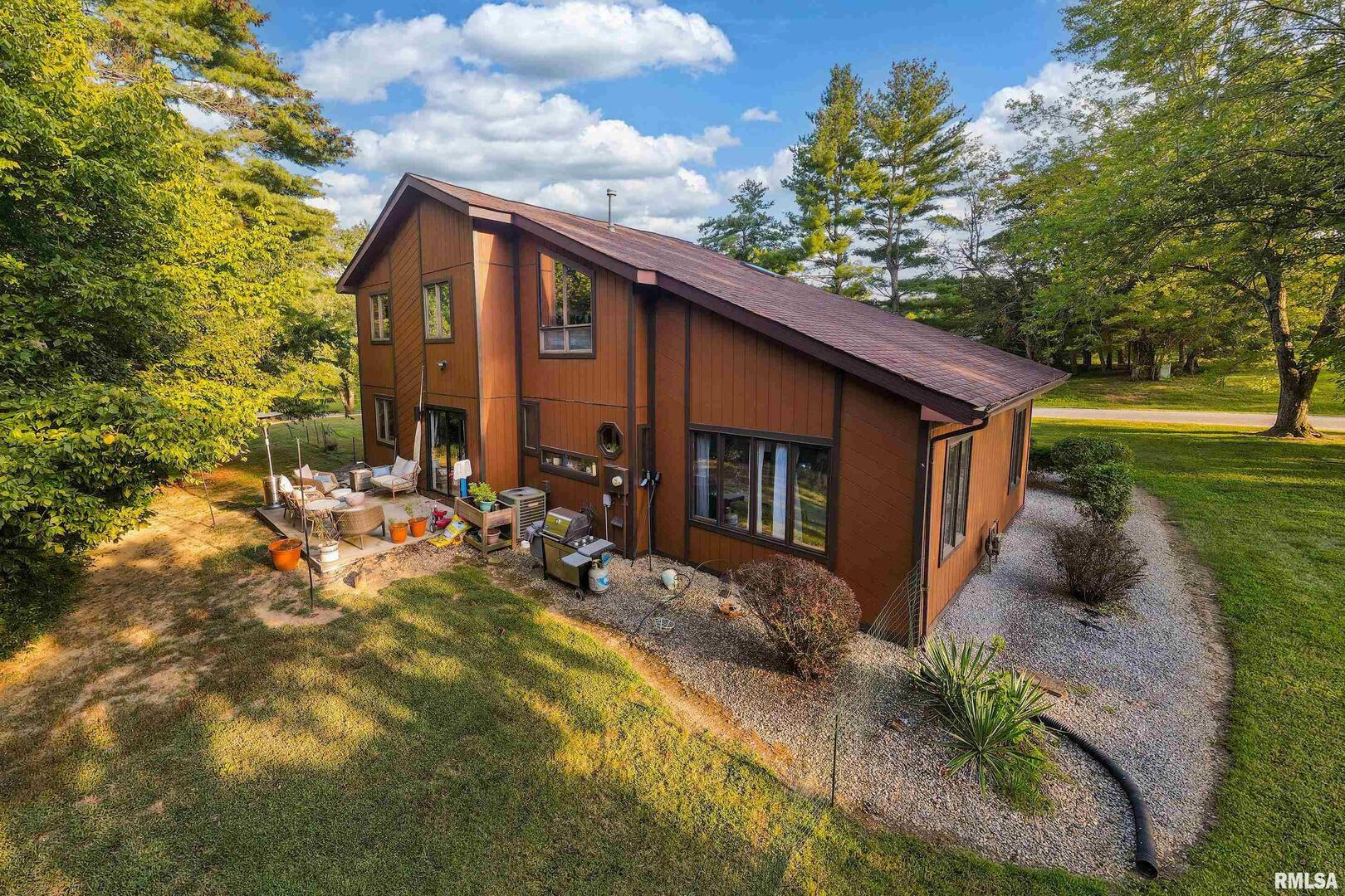 183 Heritage Road Carbondale, IL 62903 - Photo 47 of 50 a view of a house with backyard and sitting area
