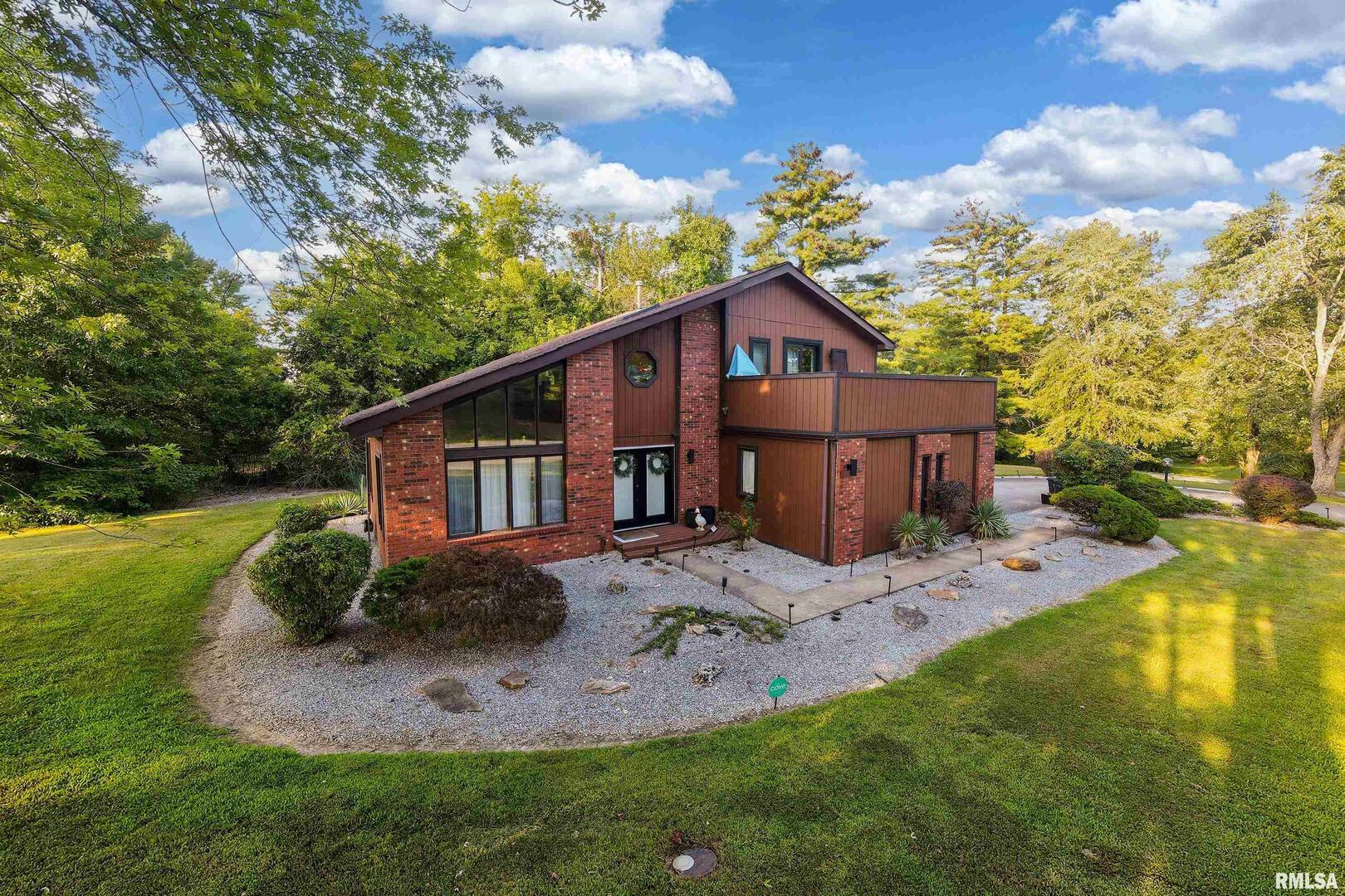 183 Heritage Road Carbondale, IL 62903 - Photo 48 of 50 a view of a house with a big yard and large tree