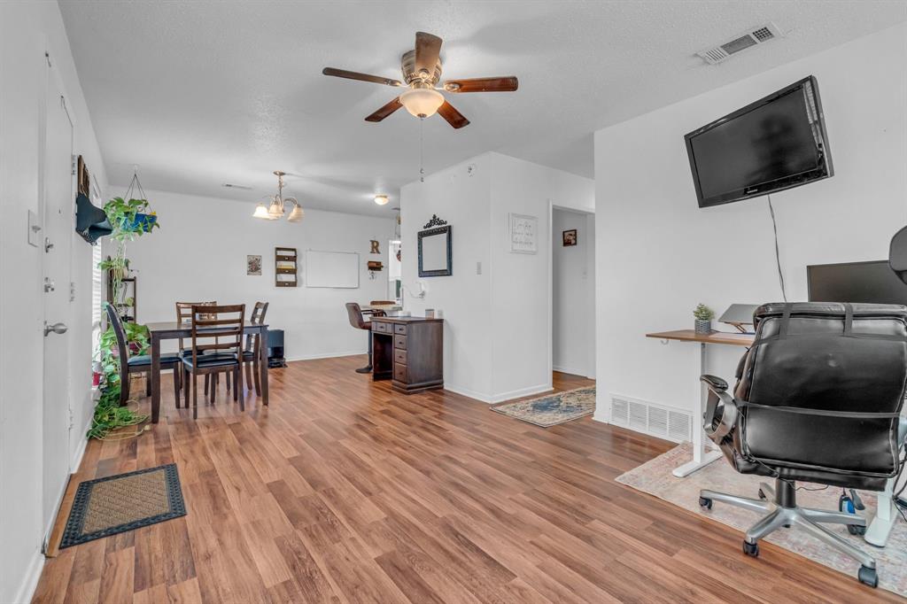 3800 Redstone Road Denton, TX 76209 - Photo 14 of 33 a living room with furniture and a flat screen tv