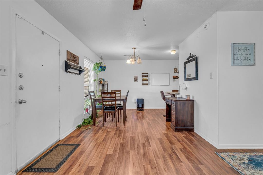 3800 Redstone Road Denton, TX 76209 - Photo 16 of 33 a view of a livingroom with furniture and wooden floor