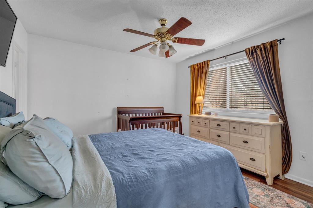 3800 Redstone Road Denton, TX 76209 - Photo 23 of 33 a bedroom with a bed and a dresser