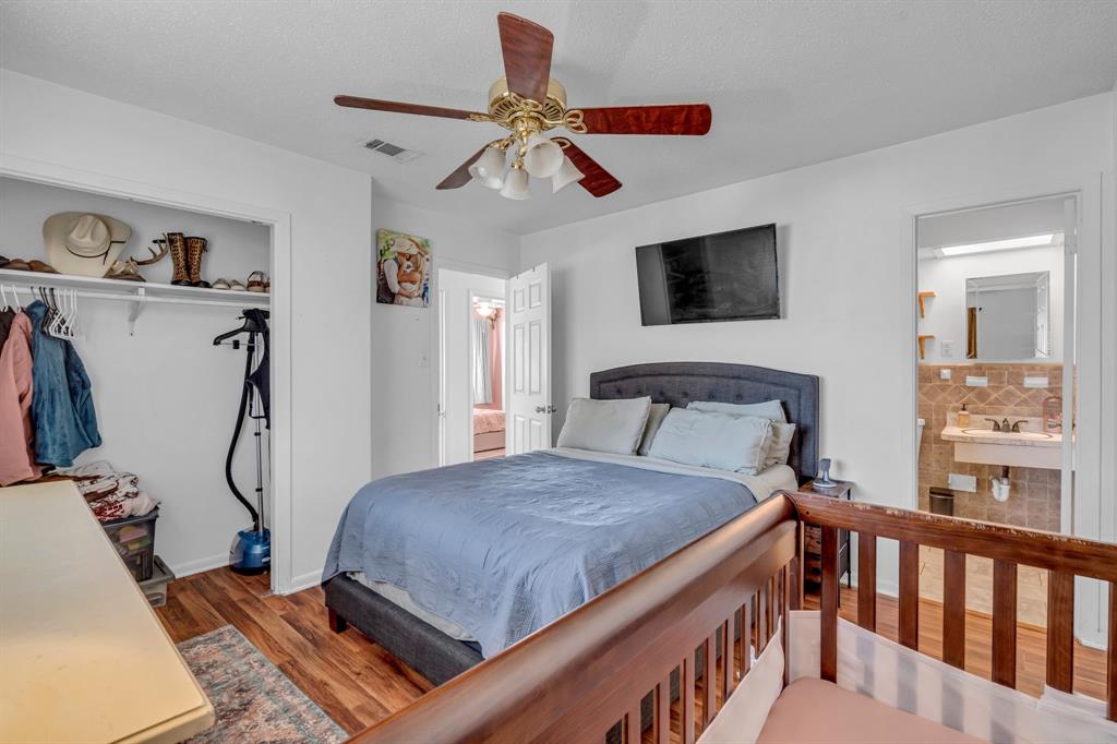 3800 Redstone Road Denton, TX 76209 - Photo 25 of 33 a bedroom with a bed and ceiling fan