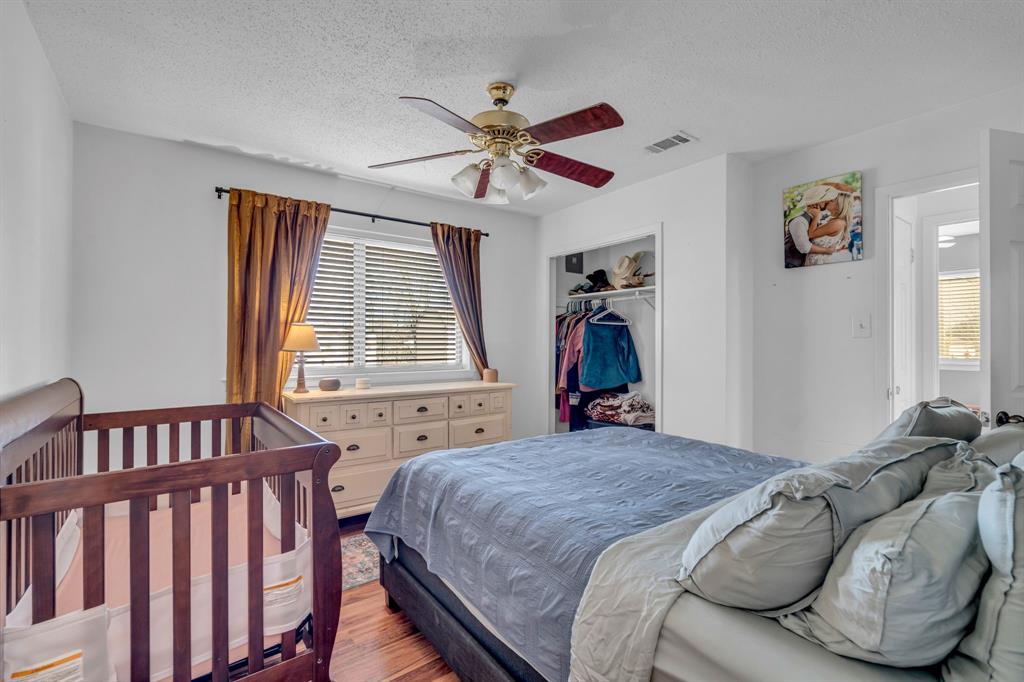 3800 Redstone Road Denton, TX 76209 - Photo 26 of 33 a bed room with a bed and a window