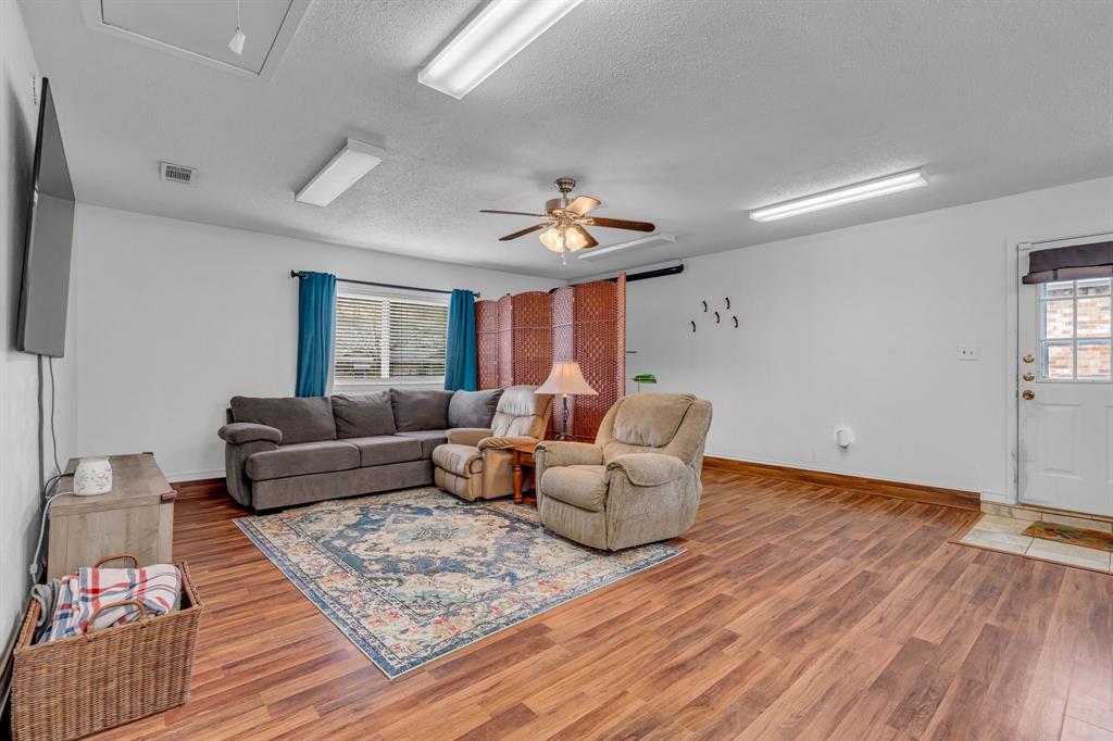 3800 Redstone Road Denton, TX 76209 - Photo 6 of 33 a living room with furniture and a wooden floor