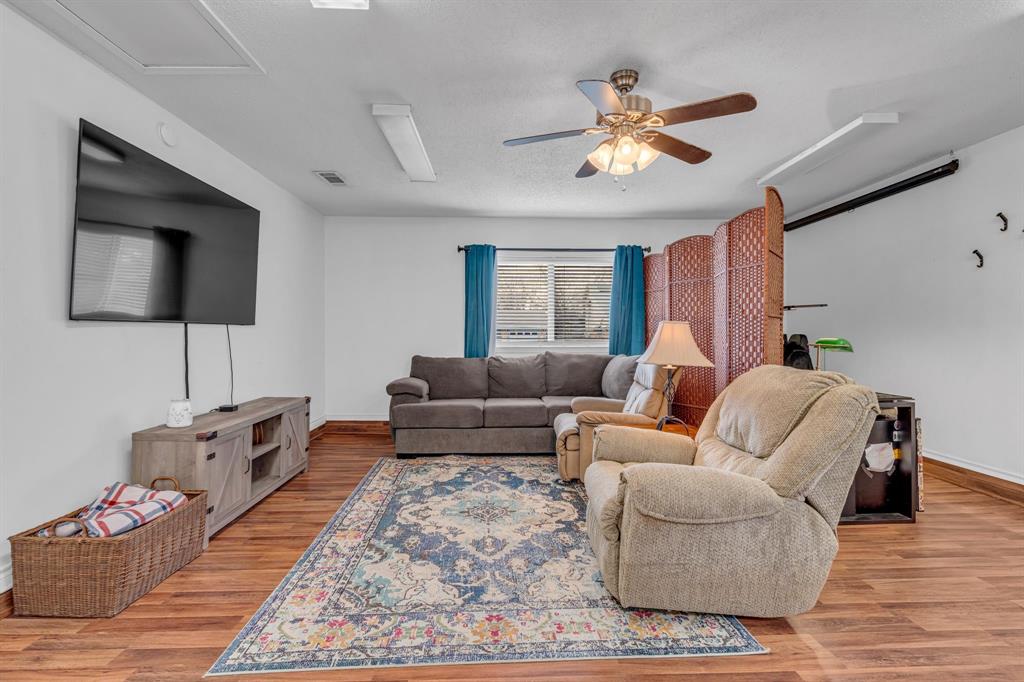 3800 Redstone Road Denton, TX 76209 - Photo 7 of 33 a living room with furniture and a flat screen tv