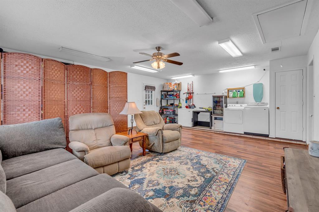 3800 Redstone Road Denton, TX 76209 - Photo 10 of 33 a living room with furniture and wooden floor