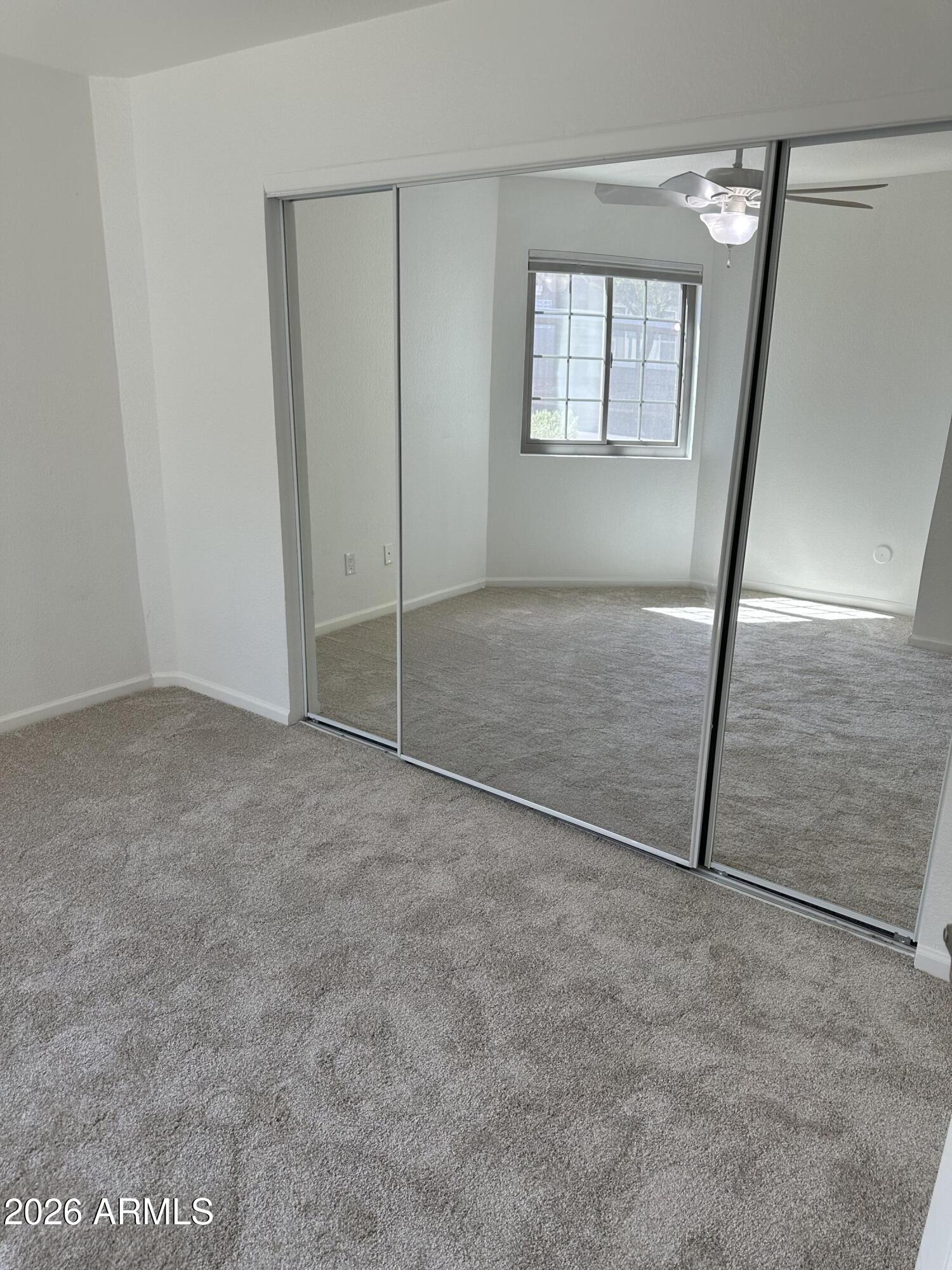 1720 East Thunderbird Road, Unit 1019 Phoenix, AZ 85022 - Photo 31 of 47 an empty room with windows