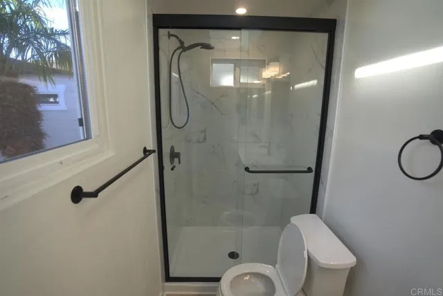 a view of a terrace with a table and chairs