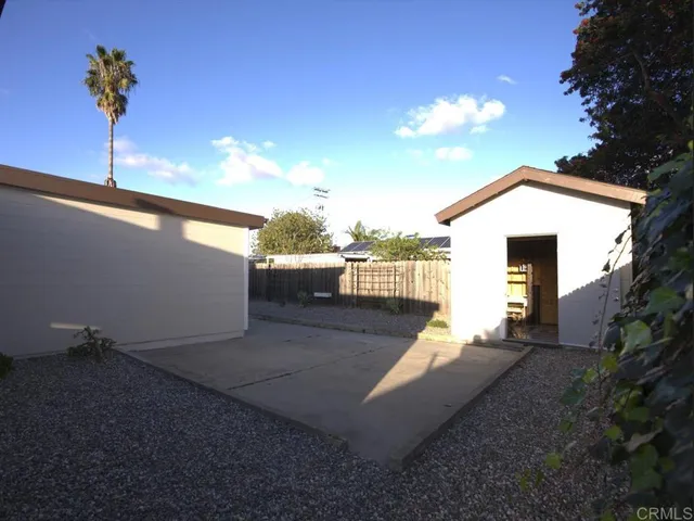 a view of hallway and washer dryer