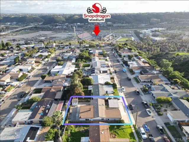 an aerial view of residential houses with outdoor space