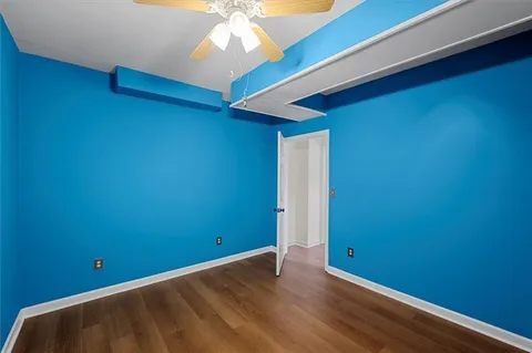 a view of room with window and ceiling fan