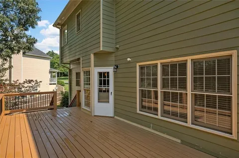 a view of a balcony with wooden floor