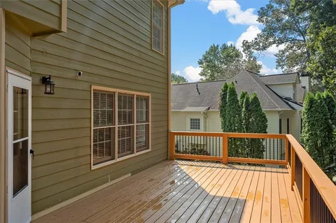 a view of backyard with a deck
