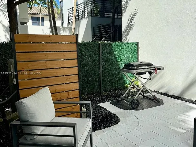 a living room with a lots of furniture and a chandelier