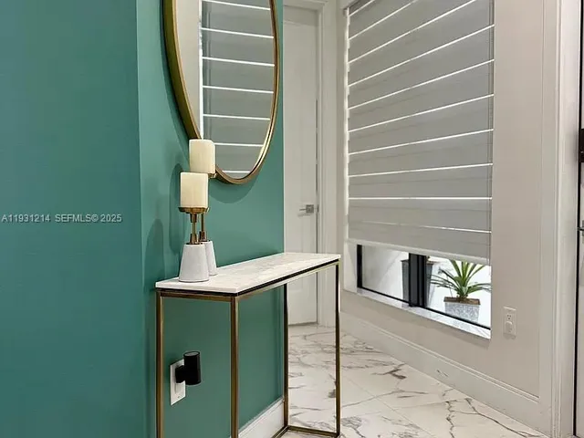 a vase of flowers sitting on a floor