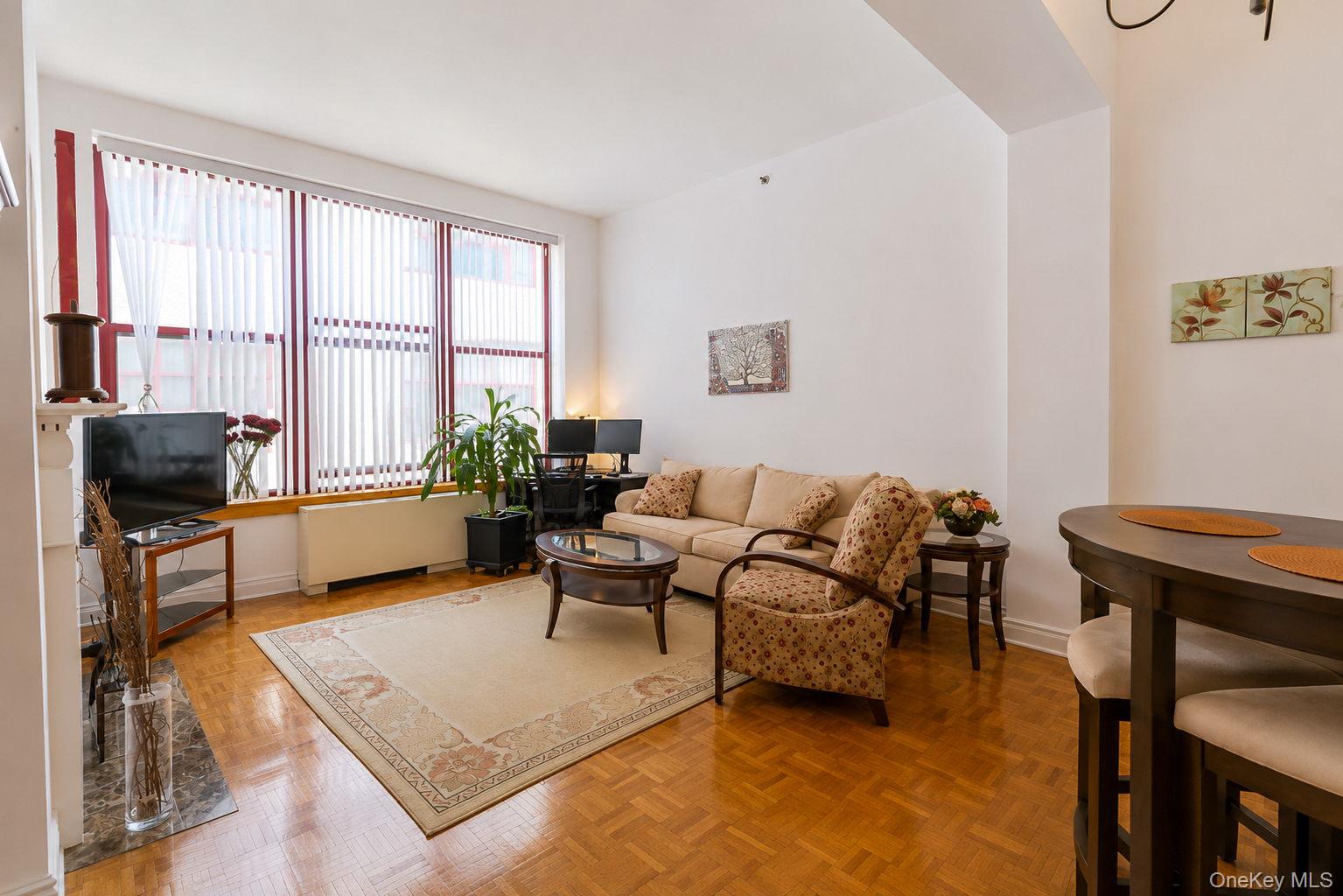 1 Scarsdale Road, Unit 409 Tuckahoe, NY 10707 - Photo 4 of 42 Spacious living room with oversized windows and parquet floors