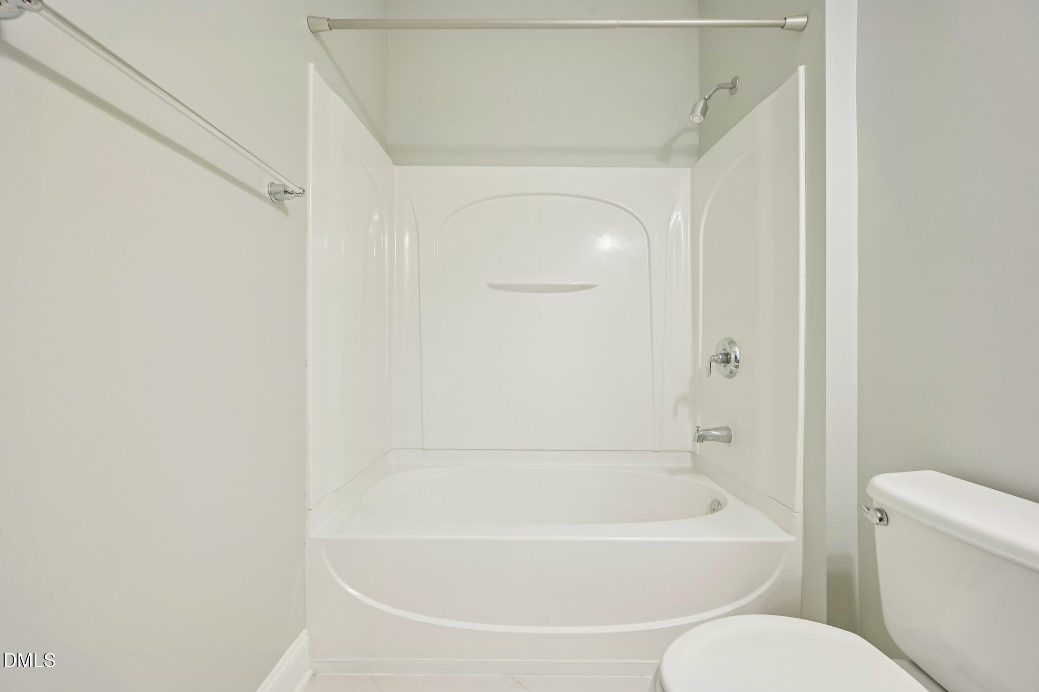 10510 Sablewood Drive, Unit 113 Raleigh, NC 27617 - Photo 30 of 38 a white bath tub sitting next to a white toilet