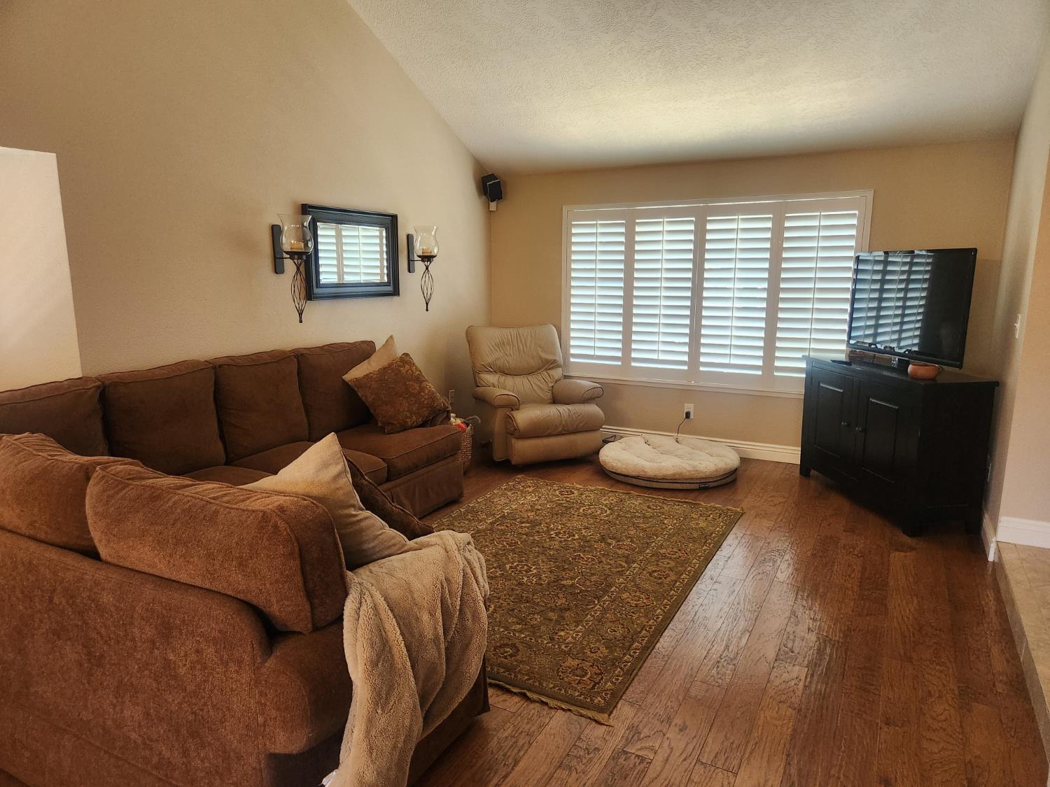 777 Jordanolo Drive Ripon, CA 95366 - Photo 16 of 61 a living room with furniture and wooden floor