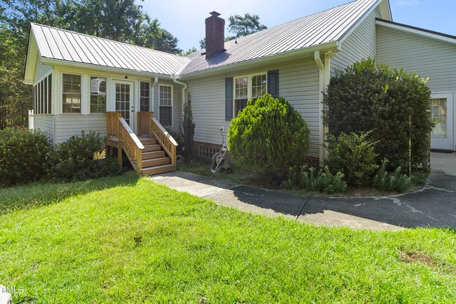 a backyard of a house with lots of green space