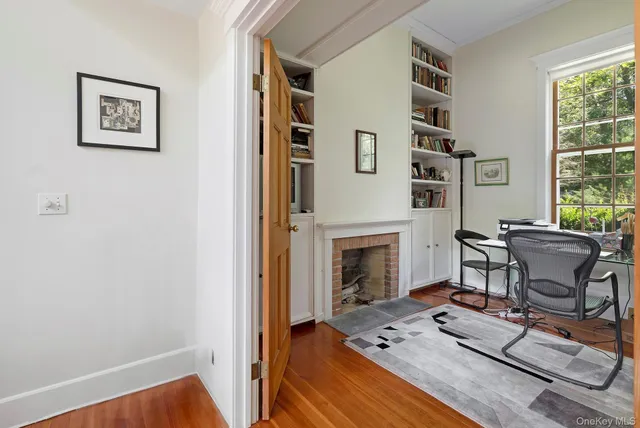 a view of a livingroom with furniture and a fireplace