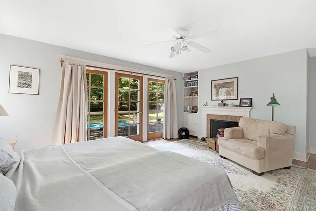 a spacious bedroom with a large bed and a large window