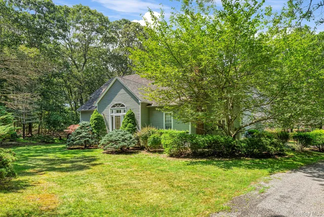 a house with a tree in front of it