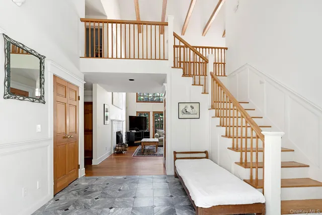 a view of entryway livingroom and hall with wooden floor