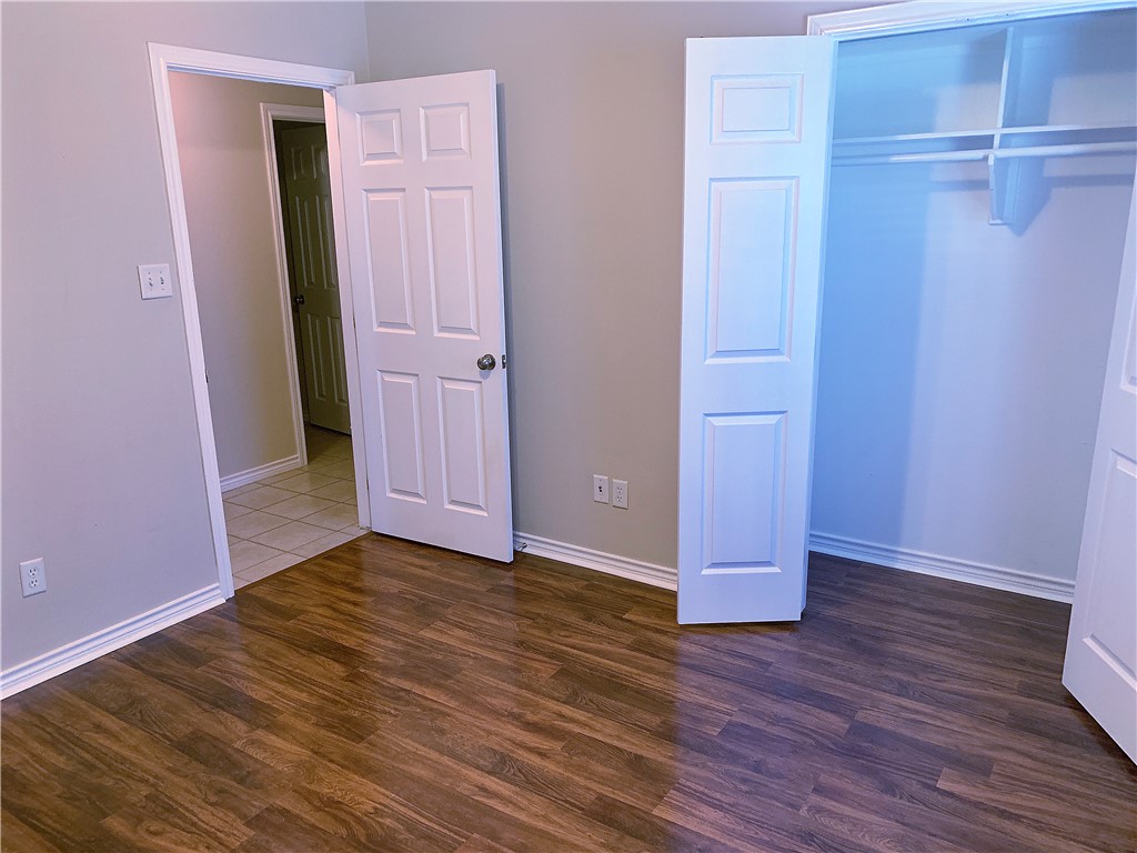 105 Karten Lane College Station, TX 77845 - Photo 13 of 26 an empty room with wooden floor and closet