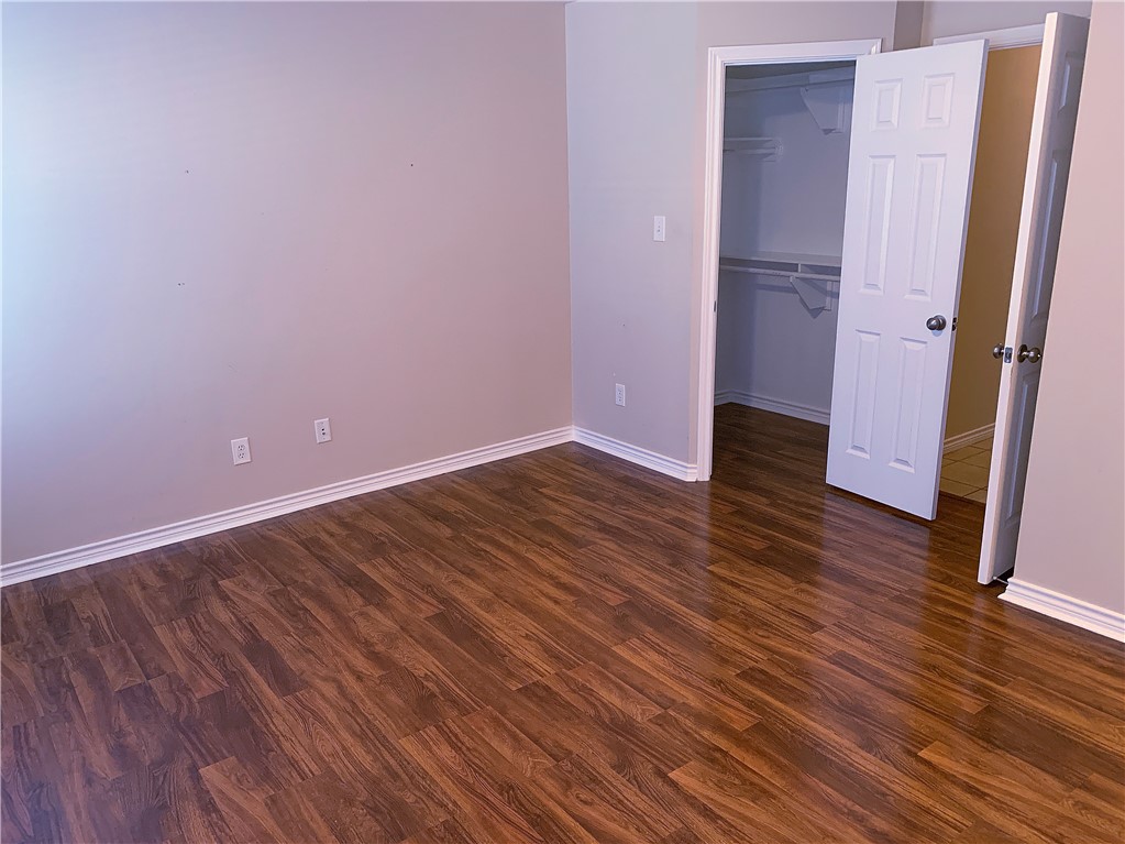 105 Karten Lane College Station, TX 77845 - Photo 15 of 26 an empty room with wooden floor and entrance