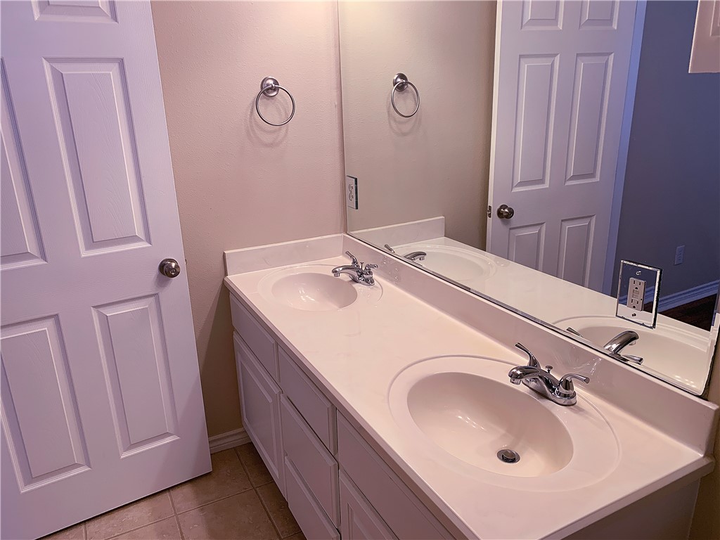 105 Karten Lane College Station, TX 77845 - Photo 19 of 26 a bathroom with a sink vanity and a mirror