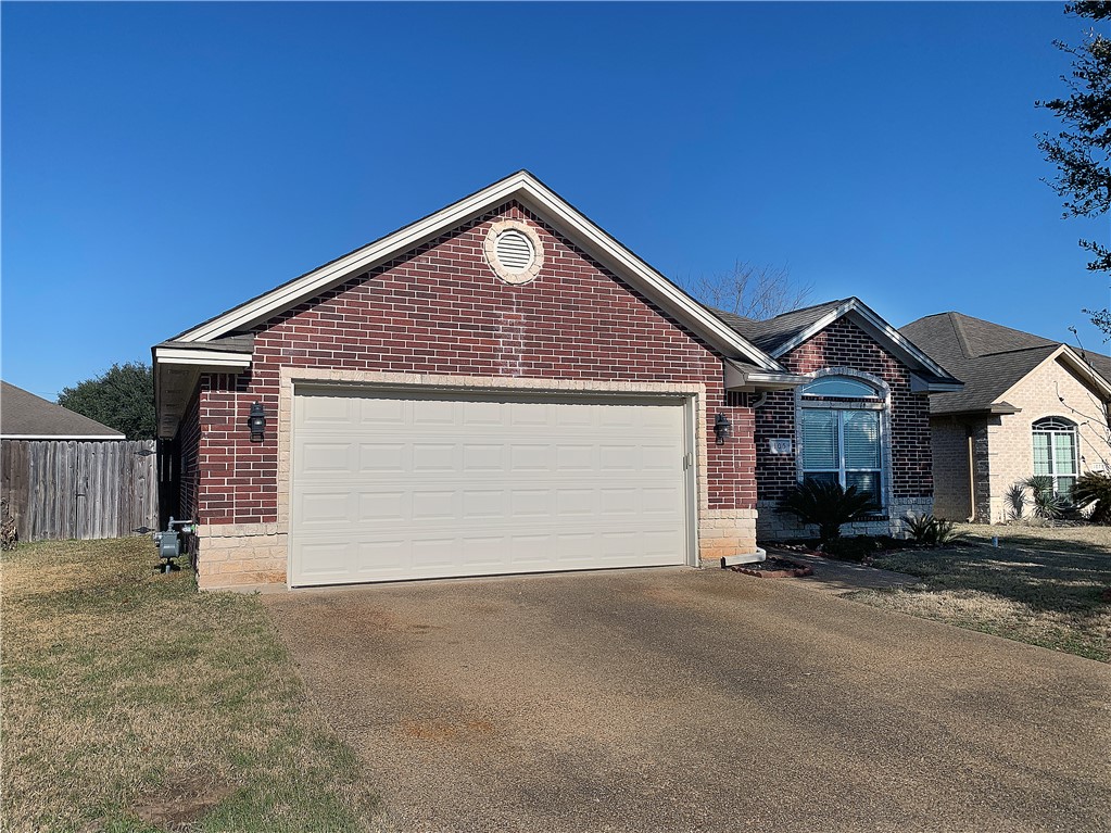 105 Karten Lane College Station, TX 77845 - Photo 2 of 26 a front view of a house with a yard