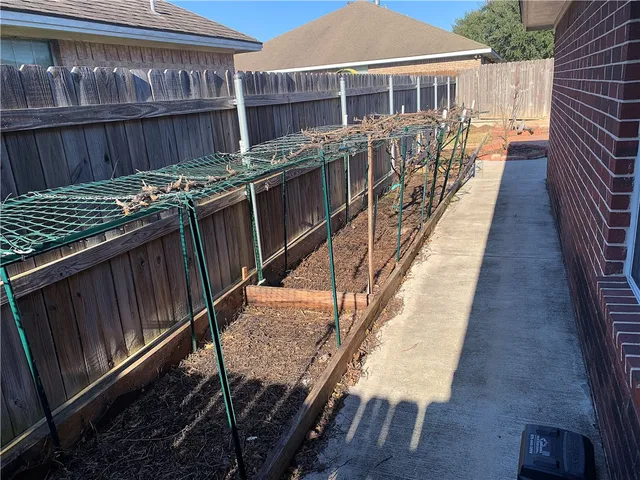 a view of a balcony with wooden floor and outdoor seating