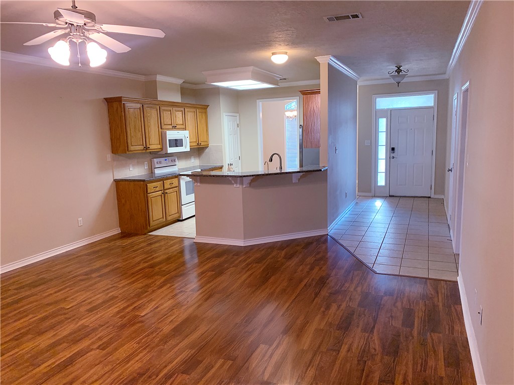 105 Karten Lane College Station, TX 77845 - Photo 5 of 26 a view of a kitchen with wooden floor and a kitchen