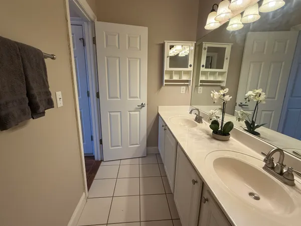 a bathroom with a sink a vanity and a mirror