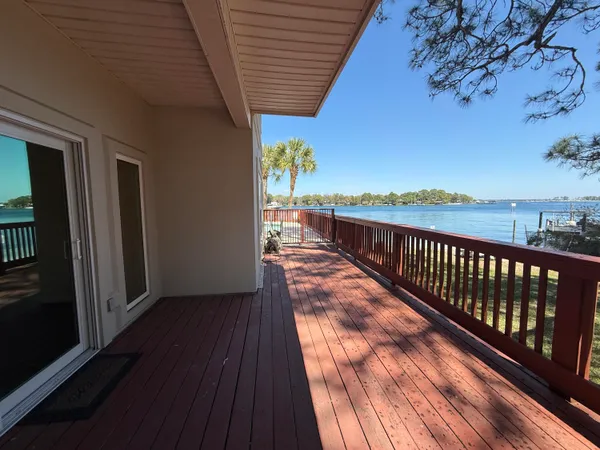 a view of balcony with wooden floor