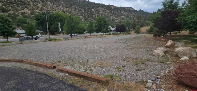 a view of a park with swings and slides