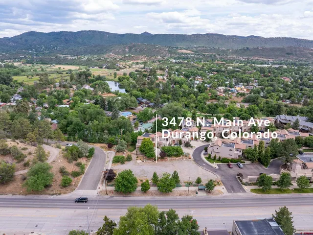an aerial view of residential houses and outdoor space