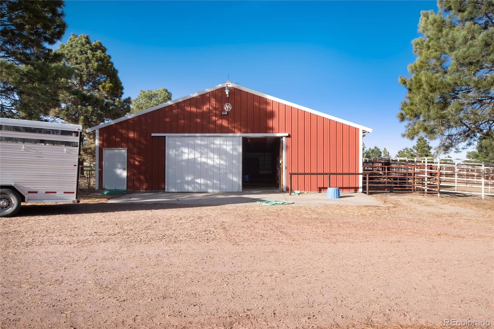 3074 County Road 166 Elizabeth, CO 80107 - Photo 12 of 13 a front view of a house with a yard