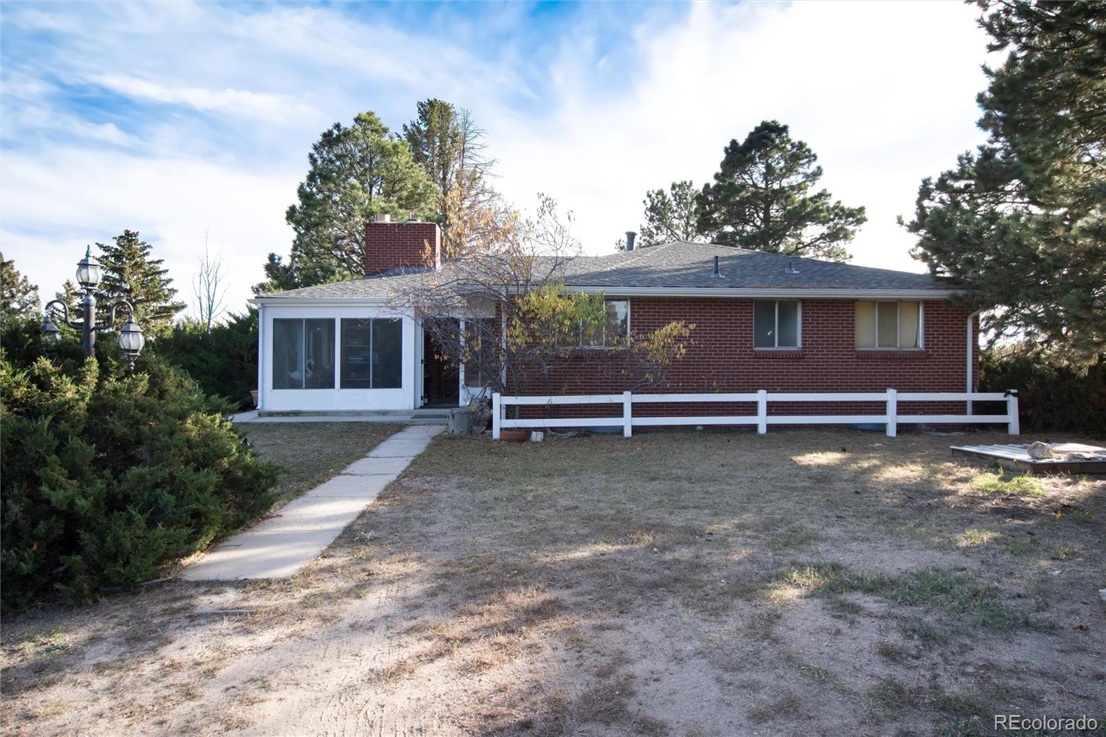 3074 County Road 166 Elizabeth, CO 80107 - Photo 8 of 13 a view of a house with a yard