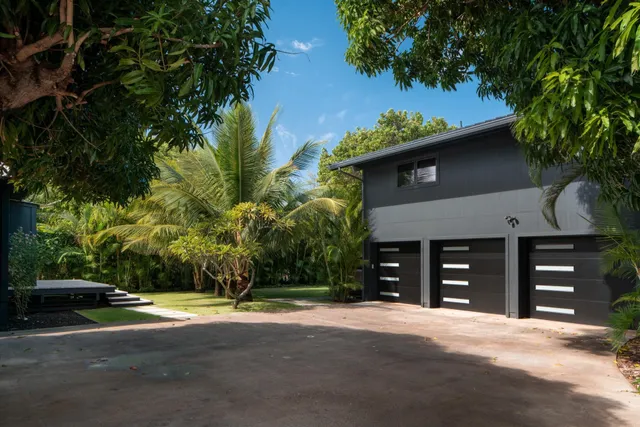 a view of a house with a yard and garage