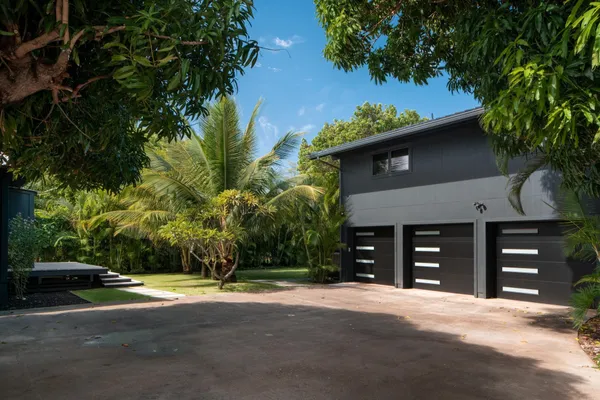 a view of a house with a yard and garage
